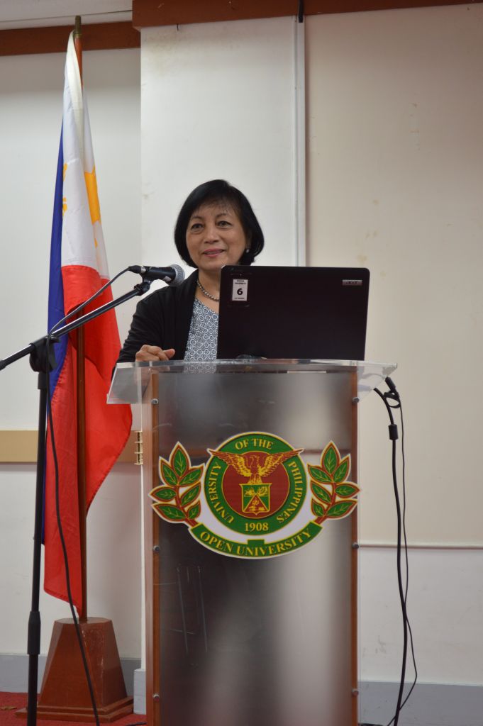 climate change consultant giving speech on roles of women and men in agriculture